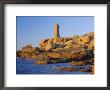 Lighthouse And Pink Granite Rocks At Sunset, Ploumanach, Cotes D'armor, Brittany, France, Europe by Ruth Tomlinson Limited Edition Print