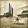 A Young Man Sitting On A Sofa Infront Of The Volkswagen Factory by Jewgeni Roppel Limited Edition Print