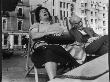 Holidaymakers Asleep In Deckchairs On The Sea Front At Brighton, West Sussex by Henry Grant Limited Edition Print