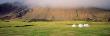 Hay Bales In A Field In Front Of A Mountain by Snaevarr Gudmundsson Limited Edition Print