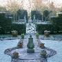 Armillary Sphere In Centre Of Formal Garden In Frost, Designer: Sir Roy Strong by Clive Nichols Limited Edition Print