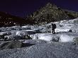 A Climber Crossing A Frozen River, Tibet by Michael Brown Limited Edition Pricing Art Print