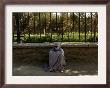 An Afghan Beggar Woman Clad In Burqa Waits To Receive Money In Kabul, Afghanistan, August 3, 2006 by Musadeq Sadeq Limited Edition Pricing Art Print
