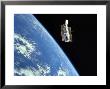 The Hubble Space Telescope With A Blue Earth In The Background by Stocktrek Images Limited Edition Pricing Art Print