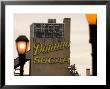 Exterior Of Domino Sugar Building, Brooklyn, With Street Lanterns In Foreground by Michelle Bennett Limited Edition Print