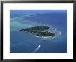 Aerial Of Boat Over Glover's Reef And Islands, Belize by Kenneth Garrett Limited Edition Print