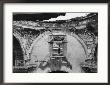 A Boy Framed In The Window Of A Ruined Cathedral; The Cathedral Was Destroyed In A 1773 Earthquake by Luis Marden Limited Edition Print