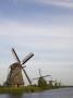 Row Of Windmills By River by Tom Paiva Limited Edition Pricing Art Print