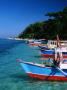 Passenger Boats Moored At Gili Air, Lombok, West Nusa Tenggara, Indonesia by Bernard Napthine Limited Edition Print