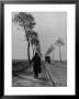 Displaced Person Returning Home From German Prison Camp, Walking Down Country Road by Ralph Morse Limited Edition Print