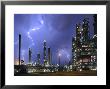 Lightning During Thunderstorm Above Petrochemical Industry In The Antwerp Harbour, Belgium by Philippe Clement Limited Edition Print