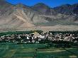 Samye Monastery With Mountain Peaks In Distance, Samye Monastery, Tibet by Bill Wassman Limited Edition Print