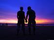 Silhouette Of A Couple Holding Hands At Sunset by Andrew Brownbill Limited Edition Print