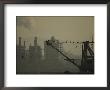 Birds Roost On The Riggings Of A Crane Near Belching Smokestacks by Joel Sartore Limited Edition Print