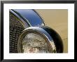 Close View Of The Headlight And Grill Of A Vintage Car by Todd Gipstein Limited Edition Print