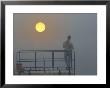 Early Morning Fisherman In Fog And Sunrise by Dennis Macdonald Limited Edition Print