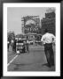 Coca Cola Sign And Thermometer Registering 100 Degrees During Columbus Circle Heat Wave In Ny by Marie Hansen Limited Edition Print