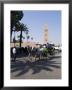 Horse And Carriage Near Jemaa El Fna With Koutoubia In Background, Marrakech, Morocco by Ethel Davies Limited Edition Print