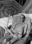 Singer Al Jolson Reading The New Yorker Magazine In Lounge Chair While Enjoying The Sun On The Beac by Alfred Eisenstaedt Limited Edition Print
