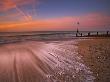 Moon Still Glows Above The Surging Tide At Sunrise On Hayling Island, Hampshire, England, Uk by Adam Burton Limited Edition Print