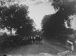 A Group Of Men Standing Around The Wreckage Of A Two-Car Collision On A Country Road by Wallace G. Levison Limited Edition Print