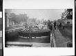 Mr. Smith And Mr. Whelan Standing Alongside A Mastless Barge By A Canal Dock by Wallace G. Levison Limited Edition Print