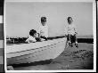 Chester Lord And Two Young Friends Sitting In A Boat On A Beach by Wallace G. Levison Limited Edition Pricing Art Print