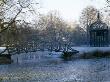 Ornamental Bird Cage And Bridge Beside Lake In Neo-Classical Park Garden, Designer: Quinlan Terry by Clive Nichols Limited Edition Print