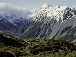 Hikers Look Up At Snowy Mountain Top, New Zealand by Michael Brown Limited Edition Print
