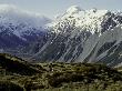 Hikers Look Up At Snowy Mountain Top, New Zealand by Michael Brown Limited Edition Pricing Art Print