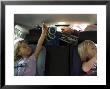 Kids Play During A Long Car Ride, Pittsburgh, Pennsylvania by Stacy Gold Limited Edition Print