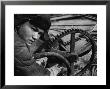 Russian Steel Worker Turning Gear Wheel In A Steel Mill by Margaret Bourke-White Limited Edition Print