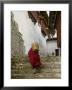 Monk Carrying Basket In Trongsa Dzong, Bhutan by Keren Su Limited Edition Print