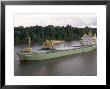Cargo Ship In The Breves Narrows In The Amazon Area, Brazil, South America by Ken Gillham Limited Edition Print