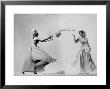 Model Wearing Wedding Gown Tossing Bouquet To Another Model Dresses As Bridesmaid by Gjon Mili Limited Edition Print