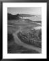 Two Golfers Playing On A Putting Green At Pebble Beach Golf Course by Nina Leen Limited Edition Print