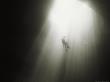 Caver Rappels The Entrance Drop Of A 150 Foot Deep Cave Pit by Stephen Alvarez Limited Edition Print