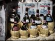 Bottles Of Chianti Displayed Outside Of A San Gimignano Shop, Italy by Robert Eighmie Limited Edition Pricing Art Print