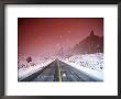 Road With Falling Snow, Arches National Park, Utah by Thomas Winz Limited Edition Print