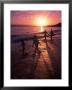 Family Walking On Beach At Dusk, Hi by Mark Gibson Limited Edition Pricing Art Print