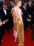 Actress Nicole Kidman, Wearing Gold Lame Dress, With Husband, Actor Tom Cruise At Academy Awards by Mirek Towski Limited Edition Print