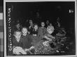 Jewish Prisoners Sitting On Ground At Lambach Concentration Camp Just After Being Liberated by Robert Holliway Limited Edition Print