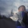 A Boy Carrying A Cat, Sweden by Mikael Andersson Limited Edition Print