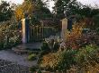 Dawn Light On Gates And Lead Urns, Autumn, Lakemount, Glanmire, Eire by Clive Nichols Limited Edition Pricing Art Print