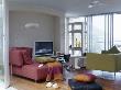 Modern Sitting Room With Large Sofas And Flat Screen Tv by Richard Powers Limited Edition Print