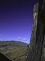 Rock Face Overlooking Mountains Below, Madagascar by Michael Brown Limited Edition Print