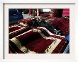 A Masked Boy Rests At A Carpet Shop In Kabul, Afghanistan, Friday, September 22, 2006 by Rodrigo Abd Limited Edition Print