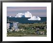 Painted Wooden Fisherman's House In Front Of Icebergs In Disko Bay, Disko Island, Greenland by Tony Waltham Limited Edition Print