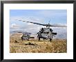 Two Hh-60 Pavehawk Helicopters Preparing To Land by Stocktrek Images Limited Edition Print
