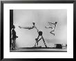 Erik Flensted Jensen, Coach Of Danish Gymnastic Team, Watching As Three Men Perform by Gjon Mili Limited Edition Pricing Art Print